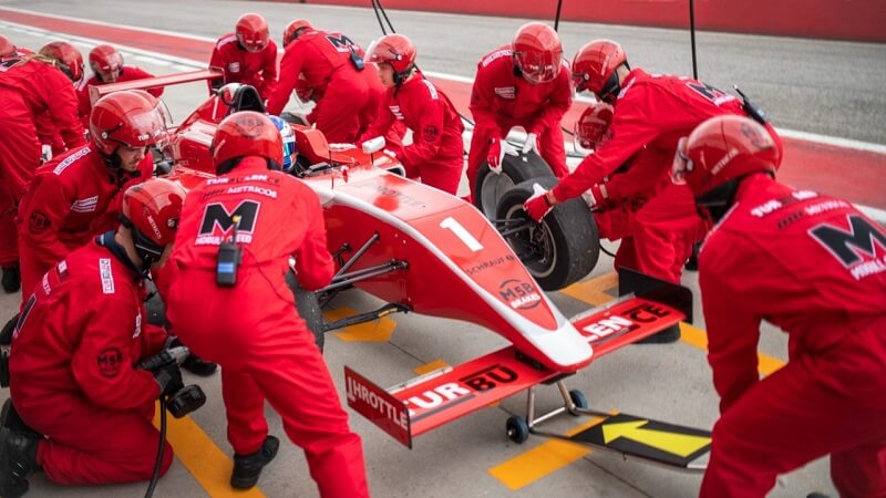 What Formula One Pit Crews Can Teach Desk Workers About Staying Injury-Free